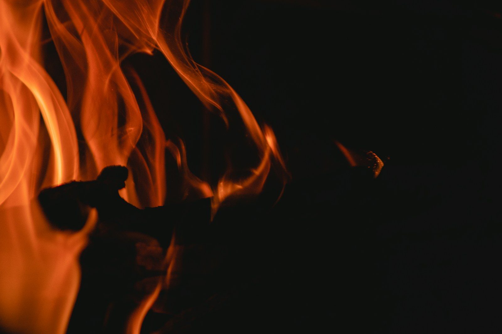 a close up of a fire in the dark